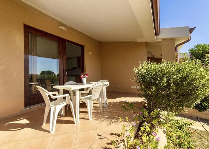 Apartahotel Isa-village In Porto Corallo Just 200 Meters From The Sea, With Private Outdoor Area